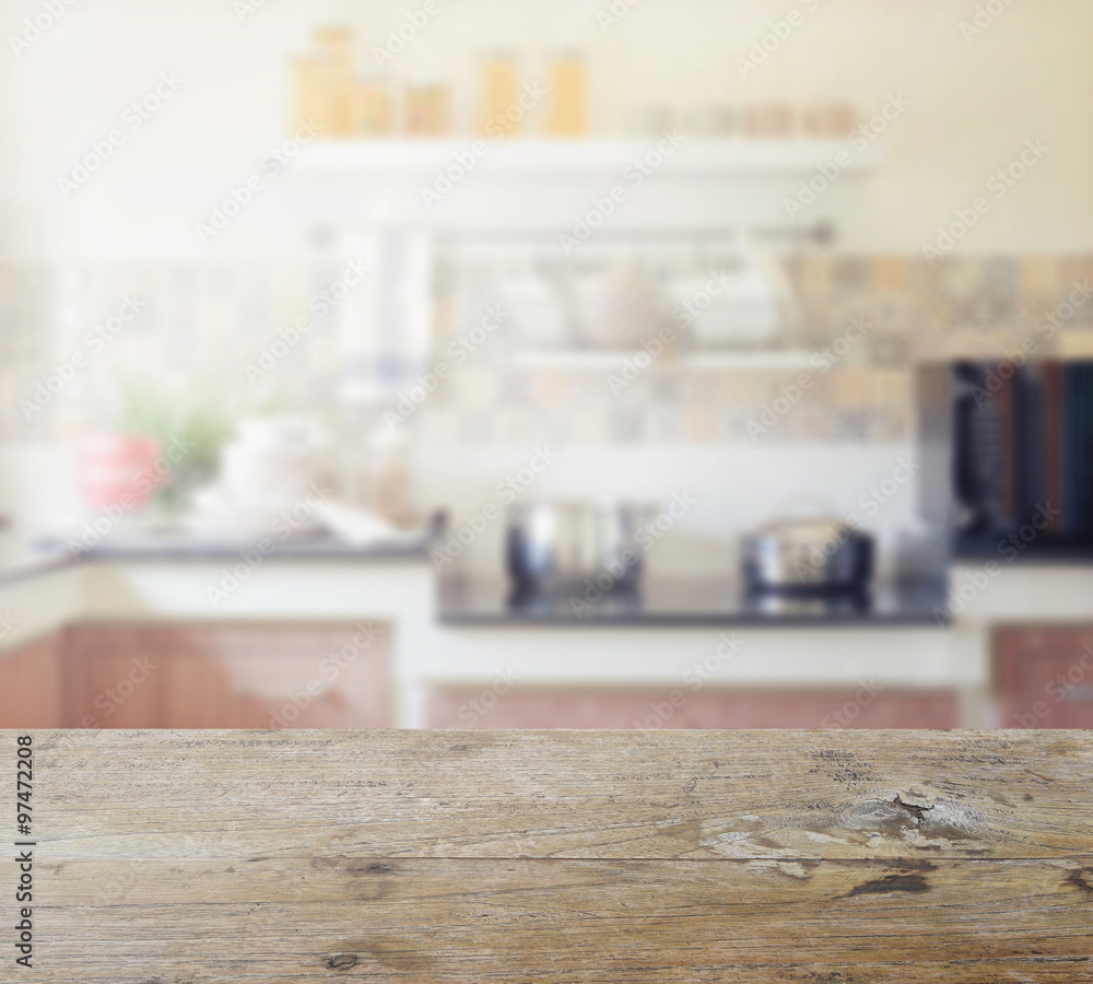 wooden table top with blur of modern kitchen interior for backgr wooden table top with blur of modern kitchen interior for backgr
