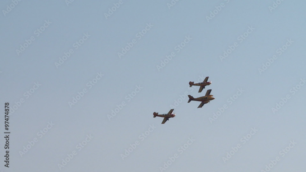 View of single-engine planes fly in formation View of single-engine planes fly in formation