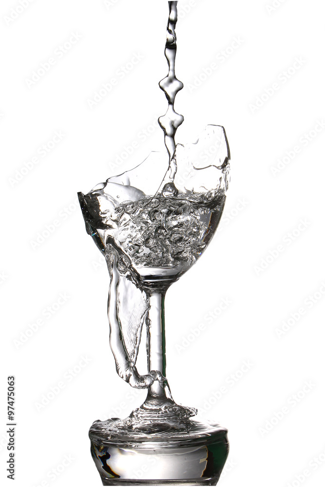 pouring water in the a broken glass, on white background. pouring water in the a broken glass, on white background.