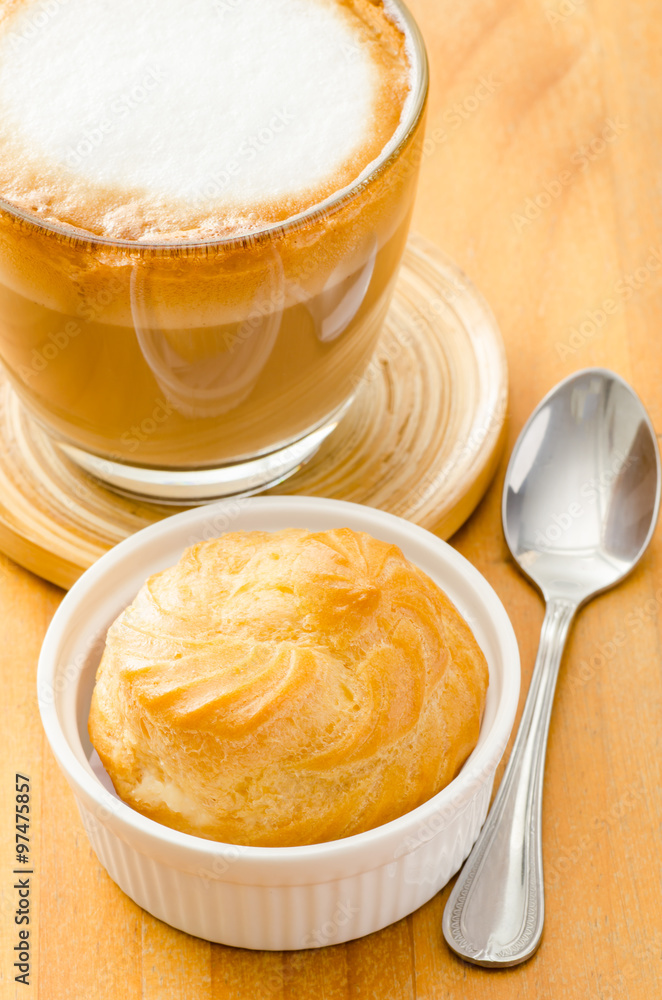 Hot coffee (cappuccino) and choux,breakfast Hot coffee (cappuccino) and choux,breakfast