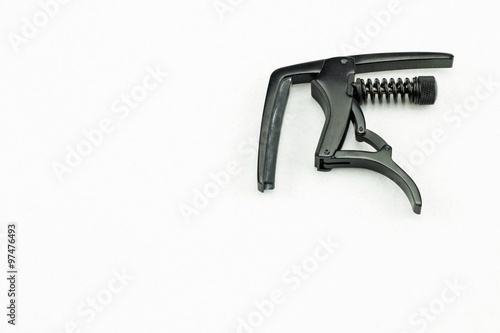 Black string capo on white background - for tune up guitars