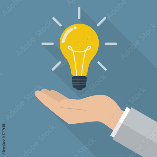 Hand holding lightbulb idea