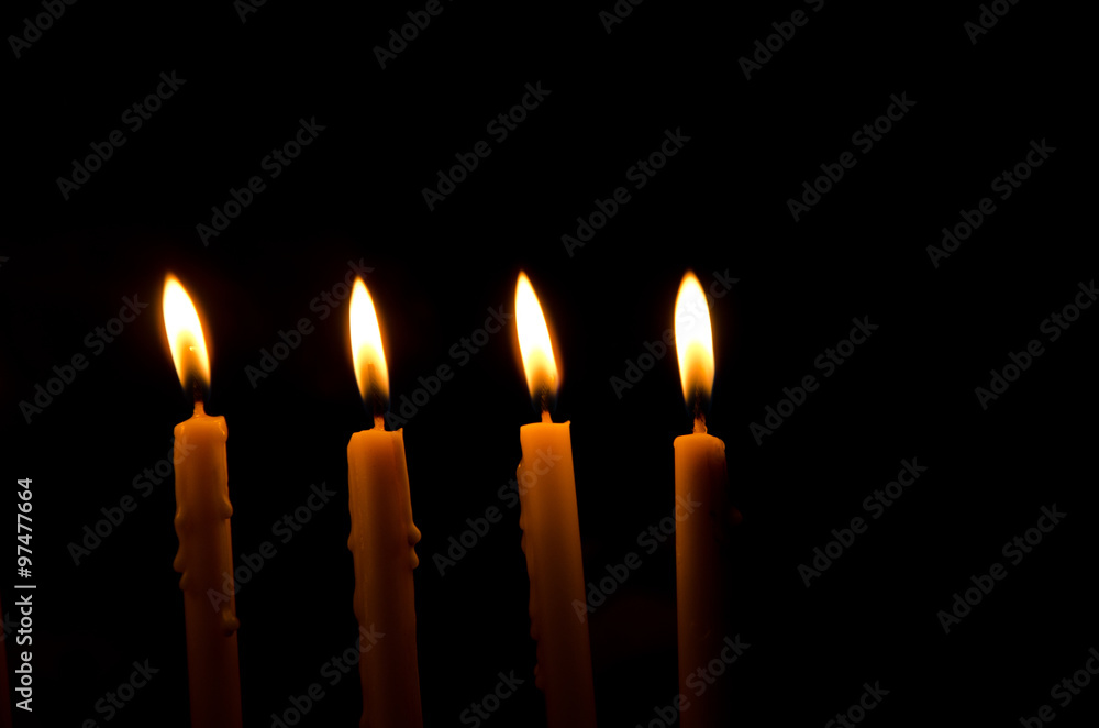 frame light candle burning brightly in the black background frame light candle burning brightly in the black background