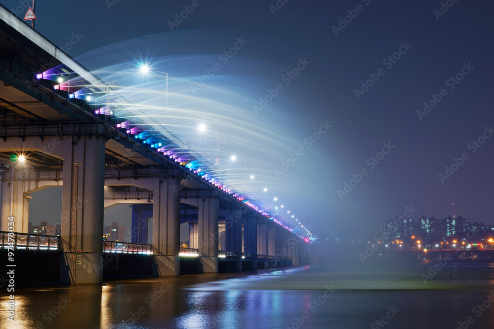 The Banpo Bridge is situated in downtown Seoul over the Han River, South Korea.  Along the bridge there is the Moonlight Rainbow Fountain