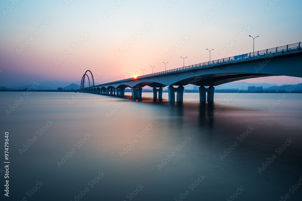 sunrise,sunset skyline and bridge over river