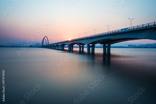 sunrise,sunset skyline and bridge over river