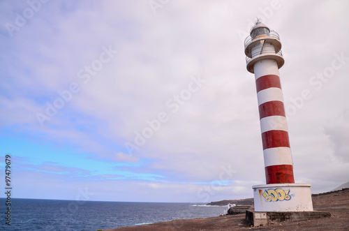 High Lighthouse near the Coast photo