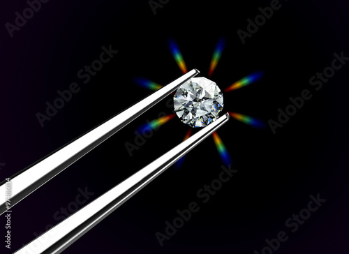Luxury diamond in tweezers closeup