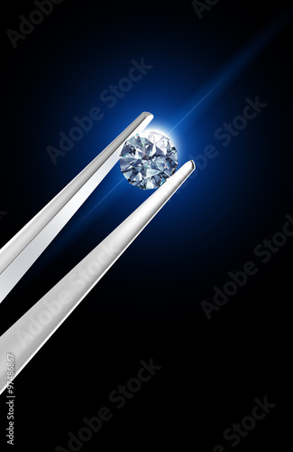 Luxury diamond in tweezers closeup