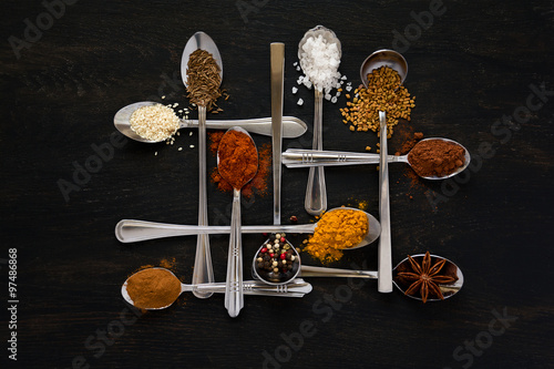 Spoons with spices photo