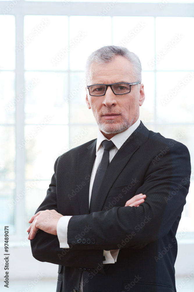 Aged businessman in white office Aged businessman in white office