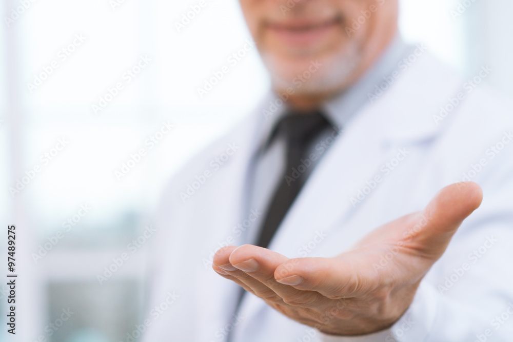 Aged doctor in hospital office Aged doctor in hospital office