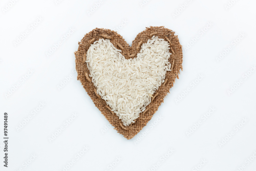 Rice lies at the heart made of burlap Rice lies at the heart made of burlap
