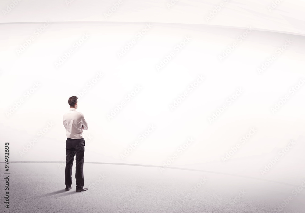 Businessman with briefcase standing still