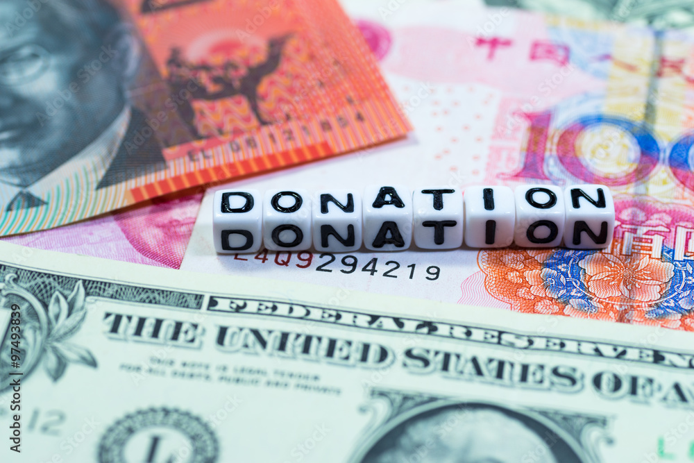 Obraz premium White blocks with the text, DONATION, on currencies