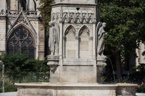 Paris - Fountain of Virgin in Square Jean XXIII near east side of Cathedral Notre Dame
