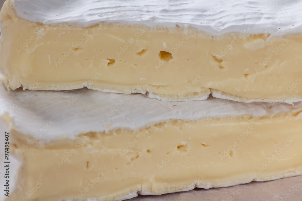 Camembert on old rustic wooden table