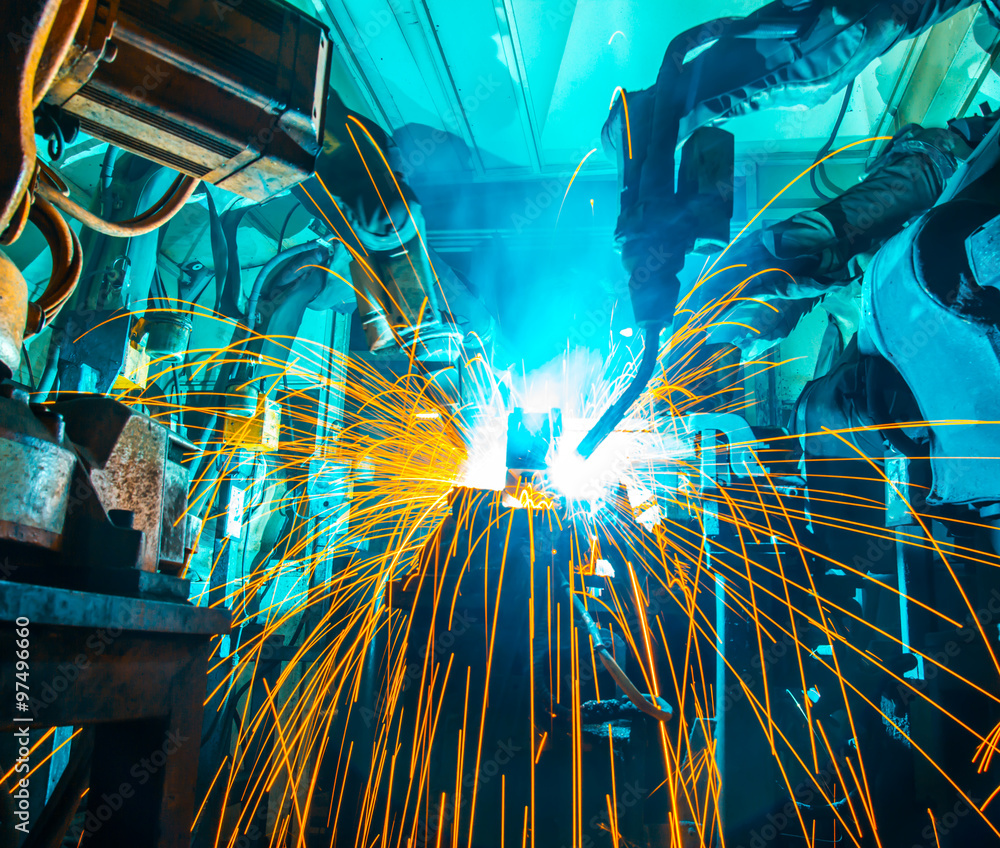 Fototapeta premium Team Robot welding movement Industrial automotive part in factory