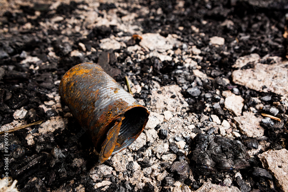 Obraz premium Tin can on burned ground