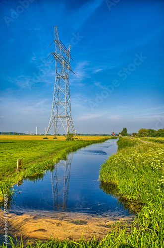 Dutch landscape with a canal and grass fields