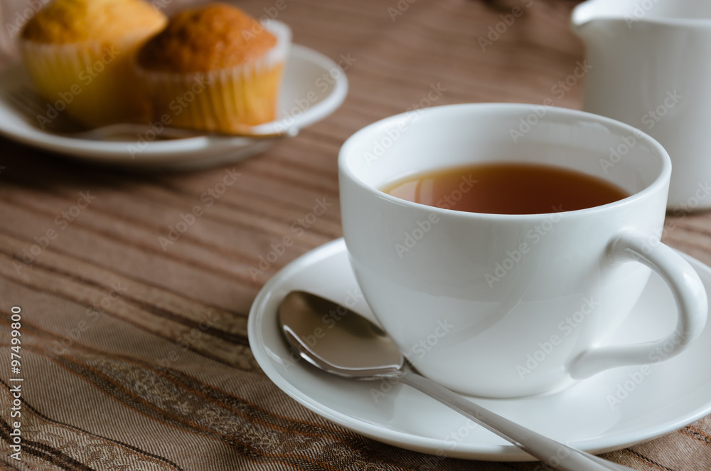 White Cup of Tea and Cup Cake for Tea Break. White Cup of Tea and Cup Cake for Tea Break.