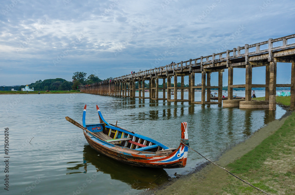 Wooden boat at Ubein Bridge, Mandalay, Myanmar (World longest wooden bridge)