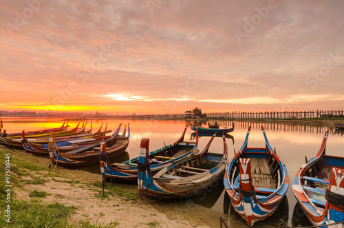 Wooden boat in Ubein Bridge at sunrise  Mandalay  Myanmar  World longest wooden bridge 