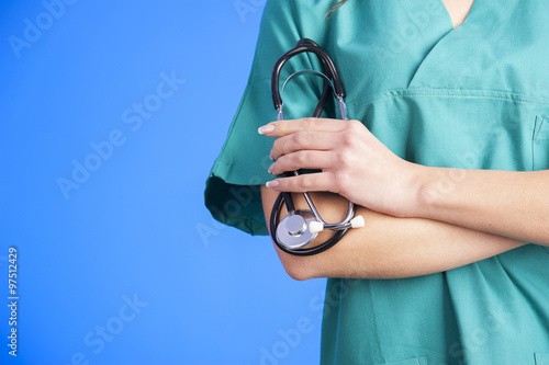 Medical blue background doctor with a stethoscope photo