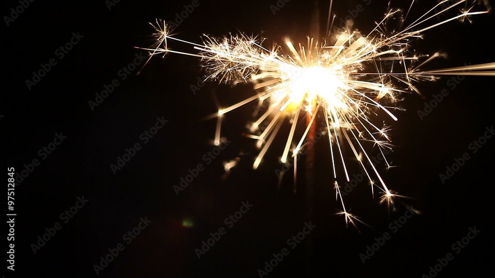 New year and Christmas sparkler on black background. New year and Christmas sparkler on black background.