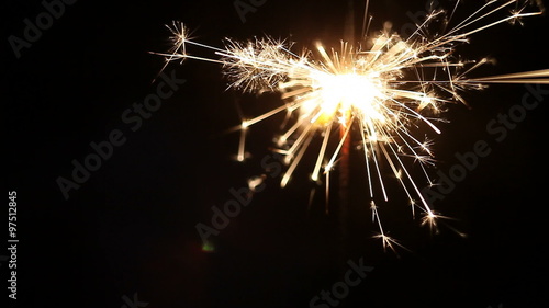 Wallpaper Mural New year and Christmas sparkler on black background. Torontodigital.ca