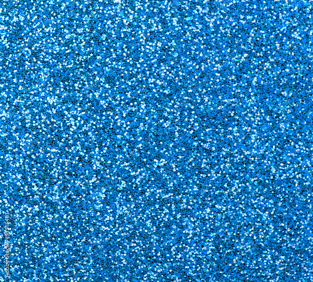 Blue glitter texture close-up as a background. Blue glitter texture close-up as a background.