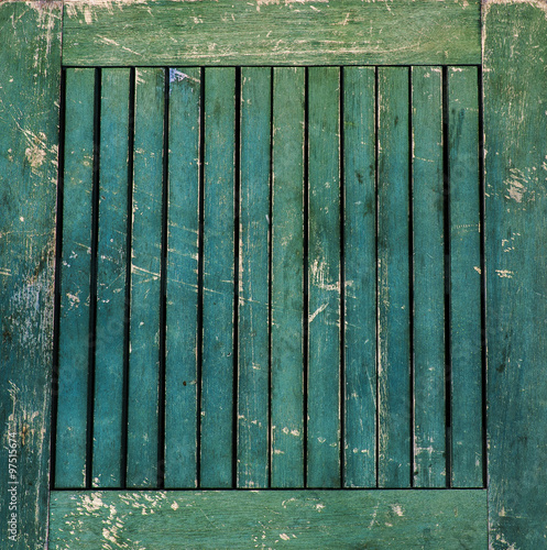 Scratched, scuffed and vintage green wooden table top background photo