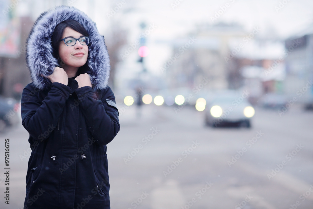snowy winter portrait of a girl in the city on the road snowy winter portrait of a girl in the city on the road