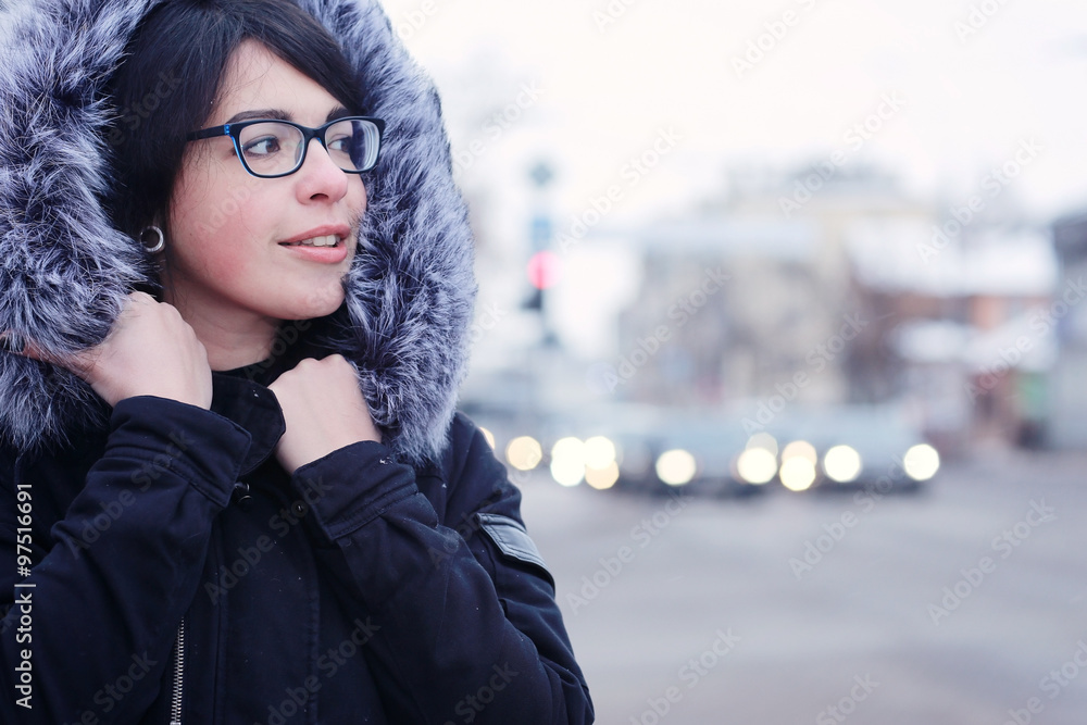 snowy winter portrait of a girl in the city on the road snowy winter portrait of a girl in the city on the road