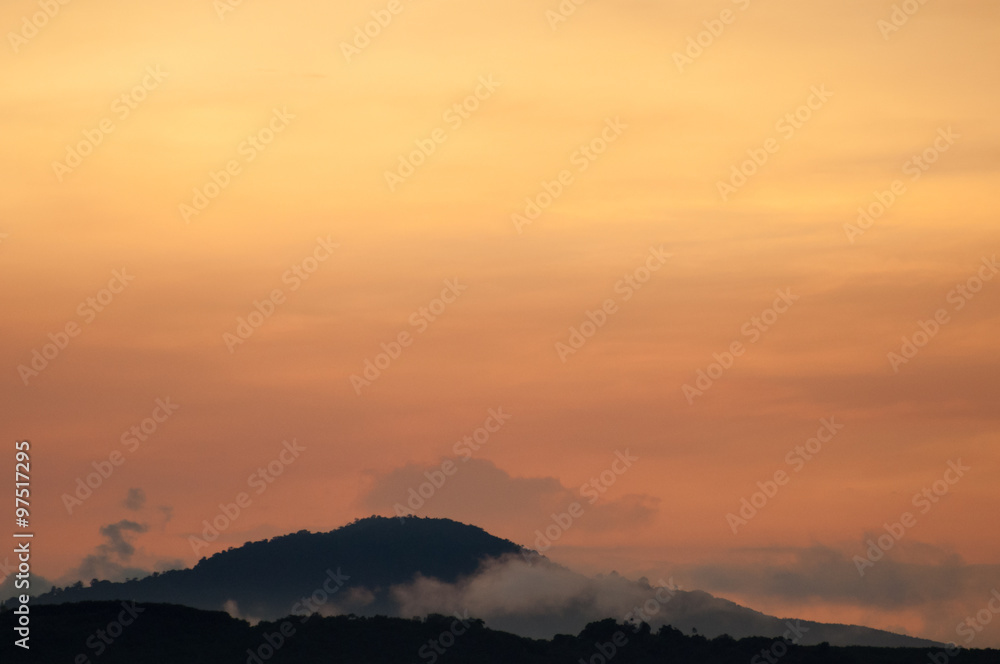 Hills with fog at sunrise