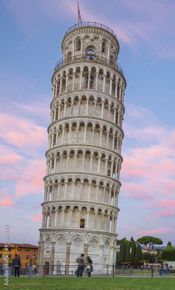 Tower of Pisa and pink clouds in the evening in Italy
