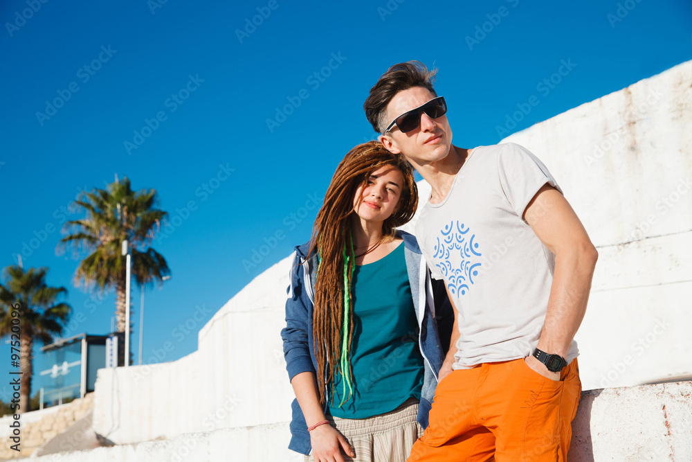 Young couple on sidewalks