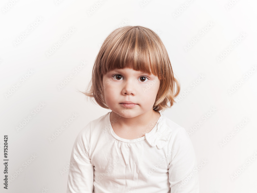 Cute little blond Caucasian girl over white background Cute little blond Caucasian girl over white background