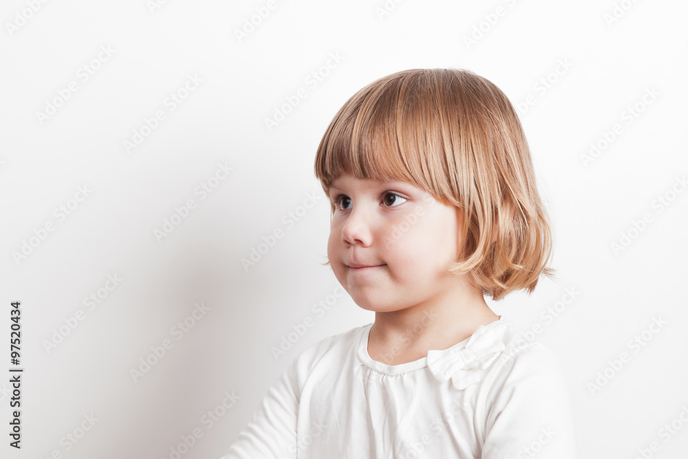 Little blond Caucasian girl over white wall background Little blond Caucasian girl over white wall background