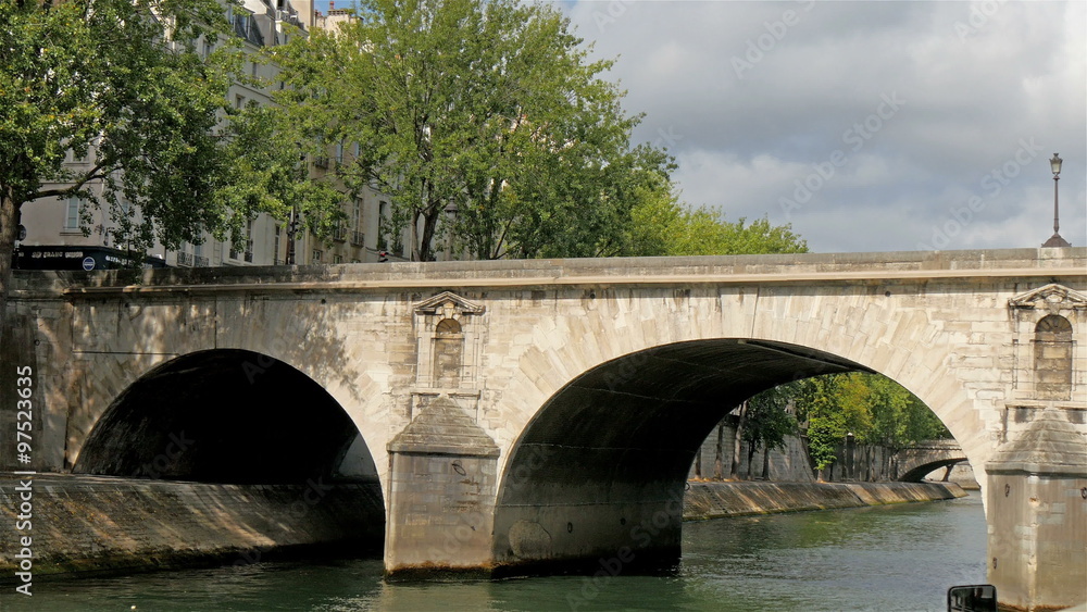 The bridge where the river in Paris is located. Going through the bridge while cruising the river The bridge where the river in Paris is located. Going through the bridge while cruising the river