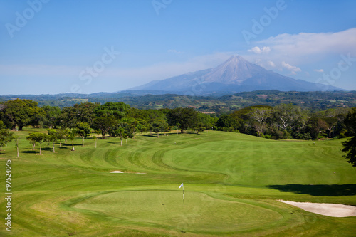 Golf course with a Volcano in the back