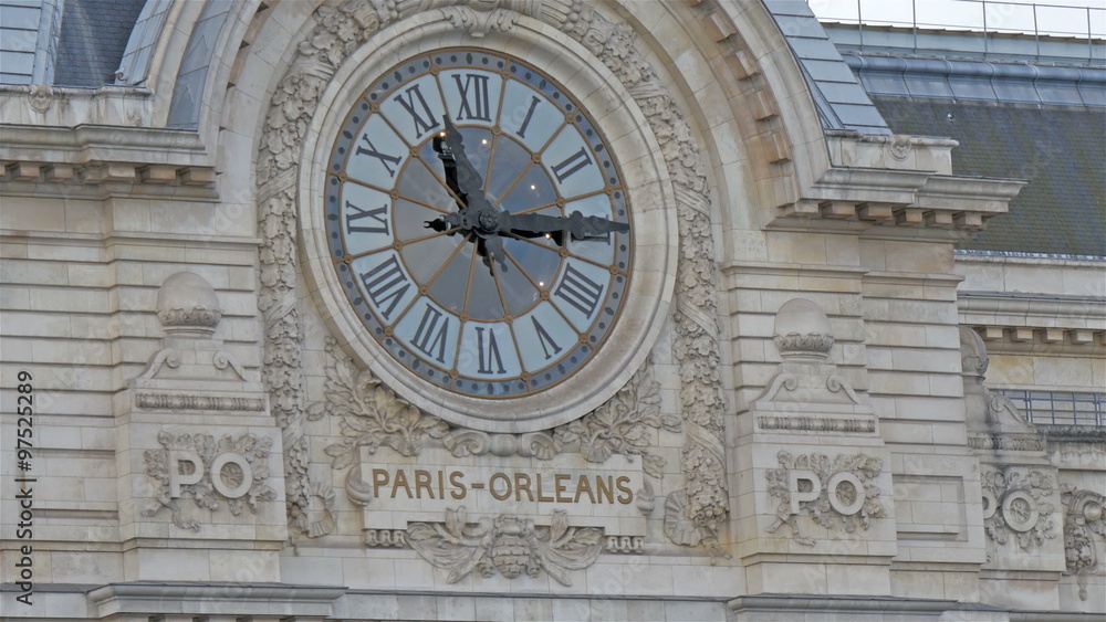 The big clock on the Paris-Orleans building. The old sytled clock with the Paris-Orleans name of the buidling The big clock on the Paris-Orleans building. The old sytled clock with the Paris-Orleans name of the buidling