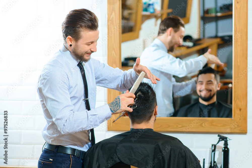 Fototapeta premium Professional barber making haircut