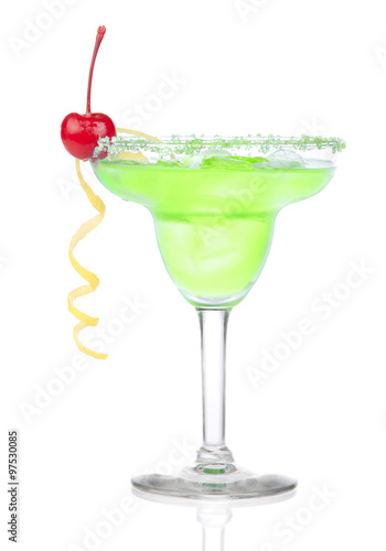 Green Margarita cocktail with red cherry in chilled salt rimmed