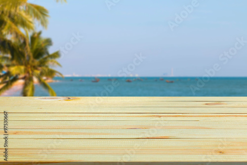 wood floor with blurred sea background. 
