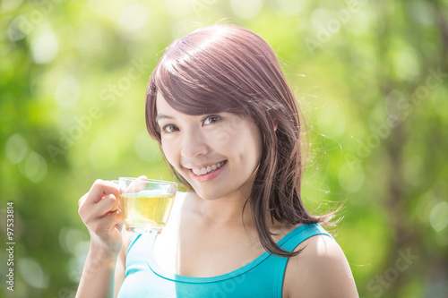 Young Woman drinking green tea