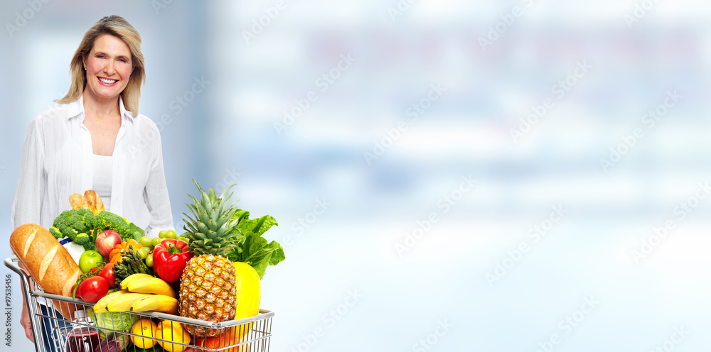 Beautiful senior woman with grocery shopping cart. Beautiful senior woman with grocery shopping cart.