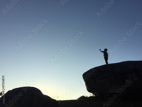 Man taking a photo on the mountain
