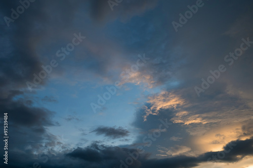 twilight sunset sky with cloudy and sunlight through clouds