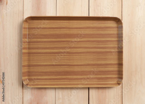 square wood tray on table wood, top view